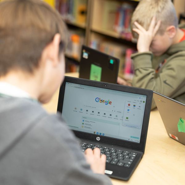 Elementary students learning digital skills